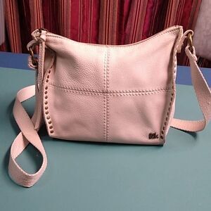 The Sak Cream color Pebbled Crossbody Adjustable Strap Zipper Top